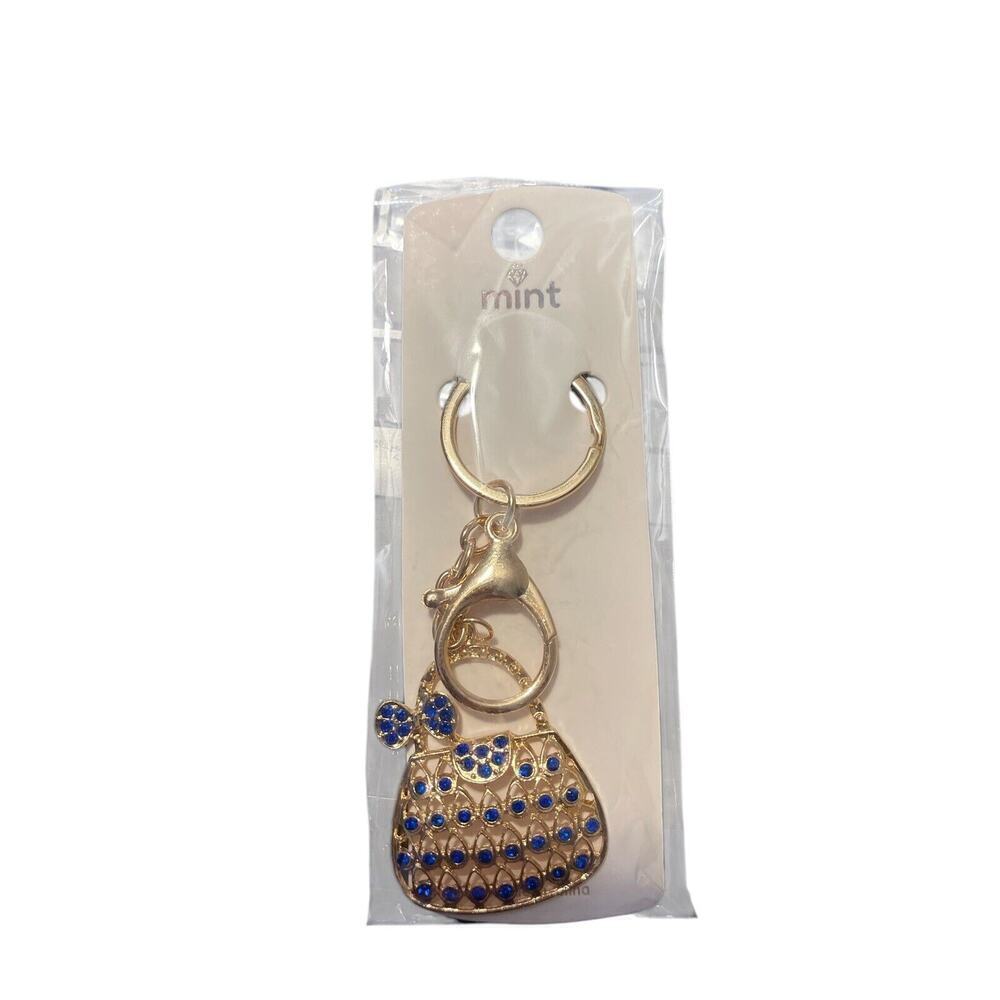MINT KEYCHAIN WITH GOLD PLATED POCKETBOOK WITH BLACK SPARKLES